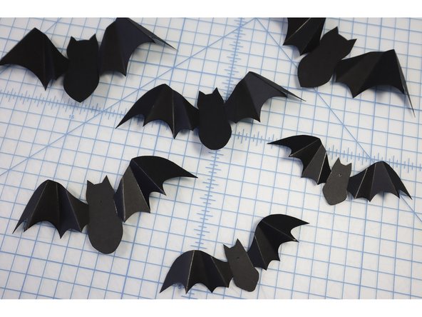 Make a hole in each bat where indicated.