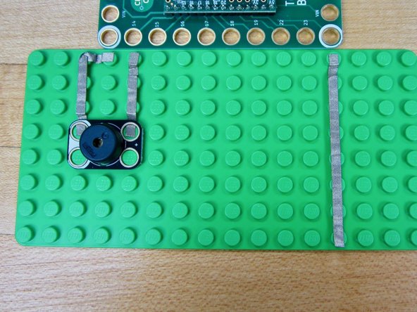 Anything conductive thats hooked up to one of the Invention Board's Touch Points will activate a note. To keep things easy we're just using some different sized lengths of tape.