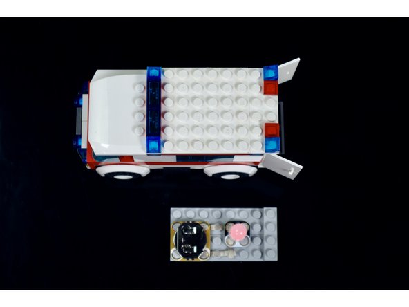 Use the second photo and the attached diagram to help you position and press the circuit components into place.