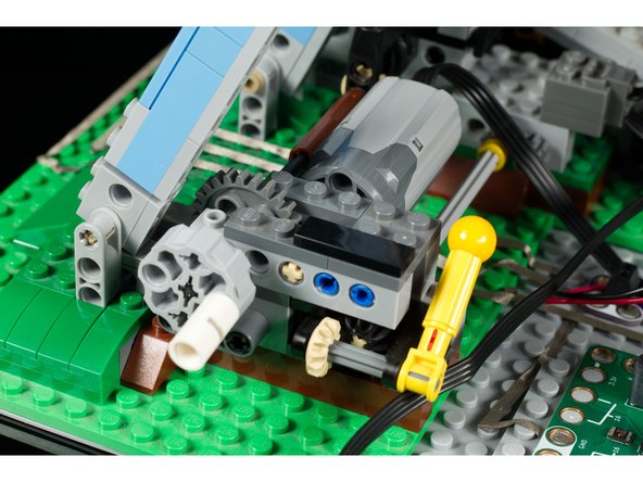 Since we wanted the micro:bit to be able to turn the motor on and off, we took advantage of the built-in relay on the Bit Board. We just ran the positive wire from the battery to a screw terminal than then connected with Maker Tape to the two connection points for the relay.