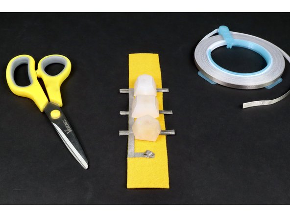 Stick the tape loop to the end of the small tape segment. If done correctly, your project should look like photo 3.