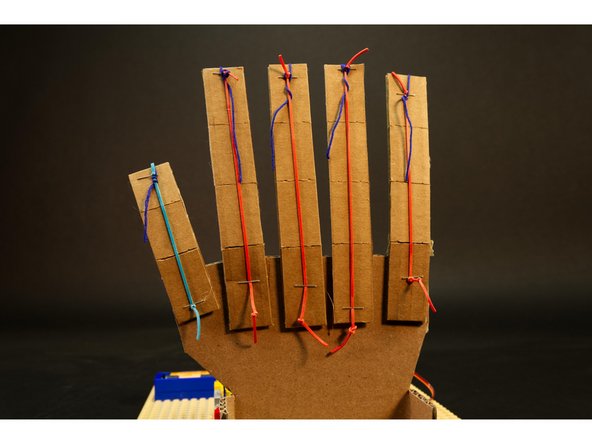 If you need to adjust the tension you can pull the rubber bands tight at the bottom of the fingers.