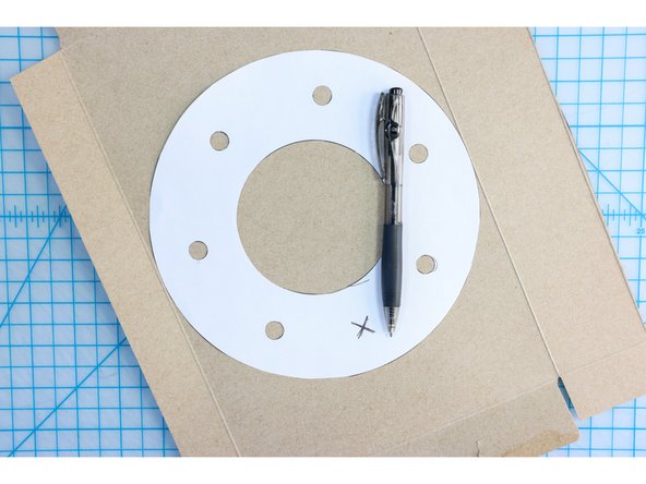 Trace the template onto cardboard or another recycled material like this cereal box.