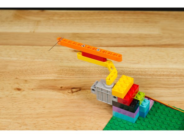 Test it by pulling out the insulator. Did the servo arm move to the correct &quot;popping&quot; position? If not, adjust how the arm sits on the servo.