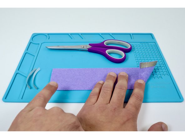 Use the remaining two pieces of Maker Tape to create an identical pad on the opposite side of the opposite end of the band.