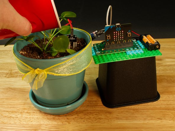 For this step it may take a bit of trial and error to get it just right. If your soil is too dry (based on what your plant needs) add some water. You should see the value displayed on the LED matrix get lower.