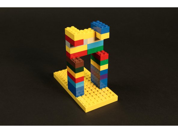 Using standard LEGO bricks build a frame on a LEGO baseplate.