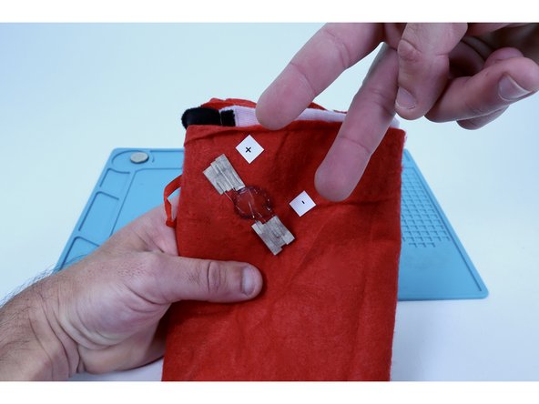 When done correctly, this will create two electrically connected Maker Tape &quot;pads&quot; with the two separate clusters of same polarity LED legs sandwiched in between.