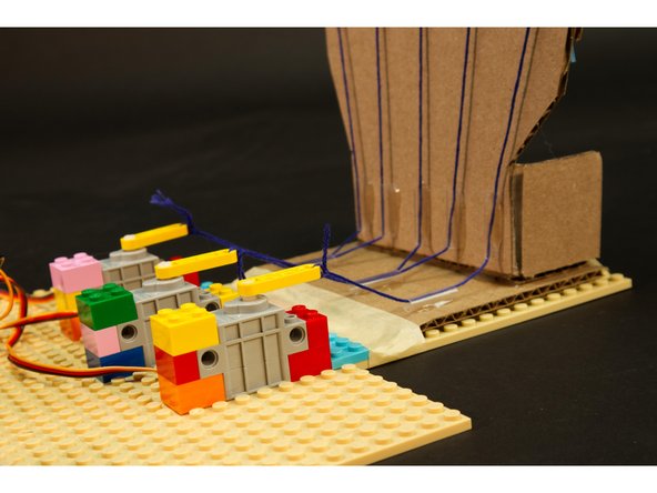 We're going to tie the strings on the servo ends so we can pull them tight at the other end of each string (on the back of the finger).