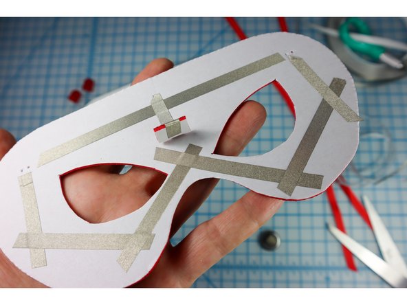 Add the piece to the mask where shown.