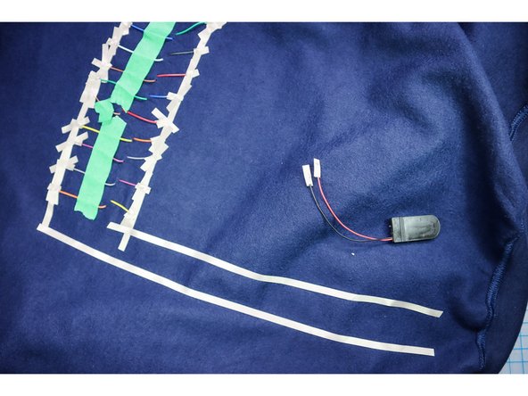 Decide on the location of your battery pack. We put ours at the bottom of the sweatshirt.