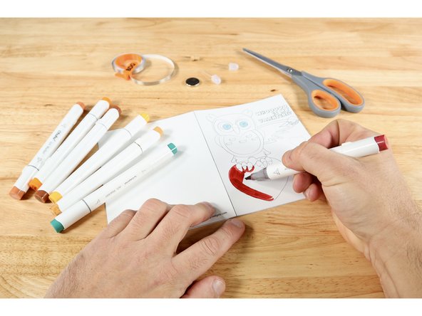 If you chose the uncolored version, now is a good time for you to use colored pencils, markers or crayons to make the cover and lettering inside look how you want it.