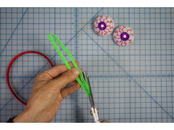 Fold it in half, then cut it into two equal pieces.