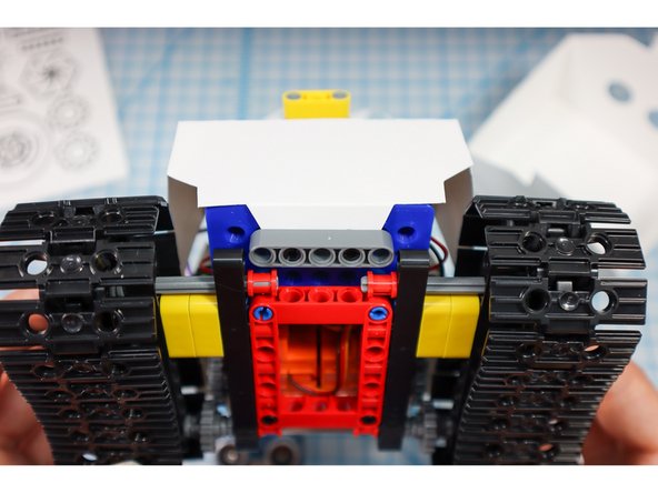 Use gray beams to hold the body in place as shown.