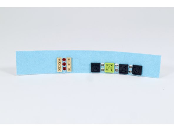 Make a multi-colored 4 LED light up bracelet using a piece of felt along with some LEGO bricks and Crazy Circuit parts.