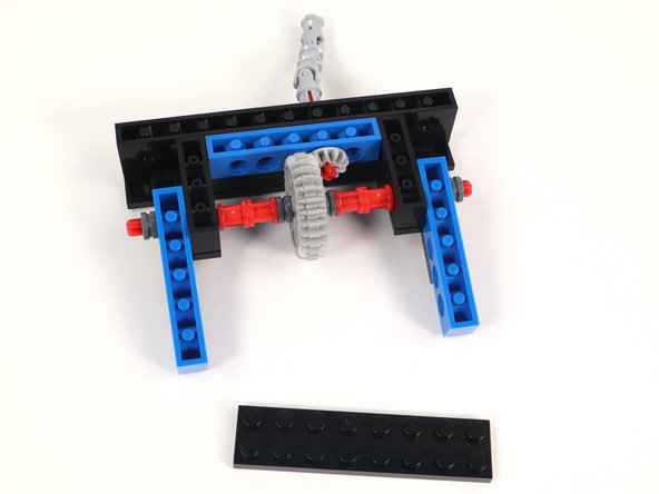 Now that you have connected Section 1 and Section 2 flip the build over and add a 2x8 plate to the bottom center of the build. This will help keep the sections together.