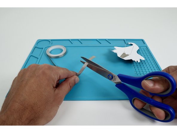 Cut a small length of Maker Tape and create a loop &quot;sticky side out&quot;. 