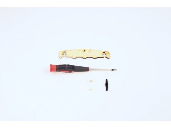 Gather the wooden side brace pictured, another servo horn from a servo bag and the remaining two small gold screws.