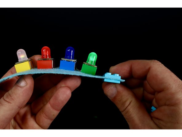 To create the LEGO clasp/closure. You will need to focus attention on those last two punched rectangles at the opposite ends of your bracelet.