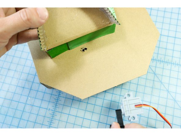 We used an awl to make our holes but if you don't have one you can use scissors or a knife.