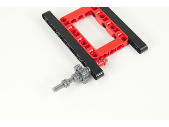 Slide the axle into the second hole of the 11 hole beam.