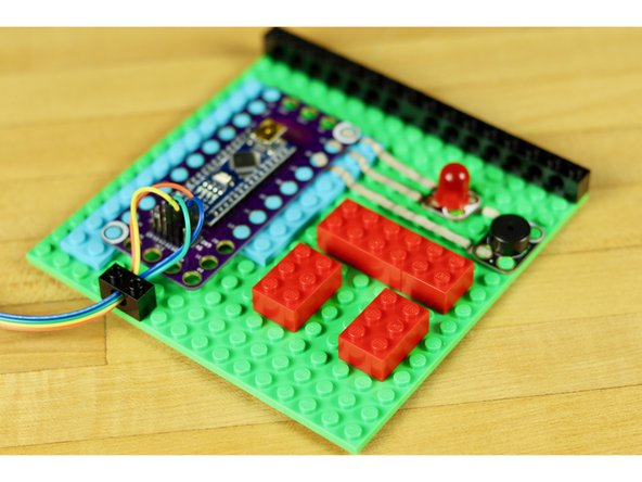 Use some 2x3 LEGO pieces to make a simple sensor holder.