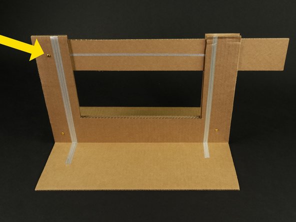 Slide the knife piece between the front and back pieces, then poke another hole for the final brass fastener.