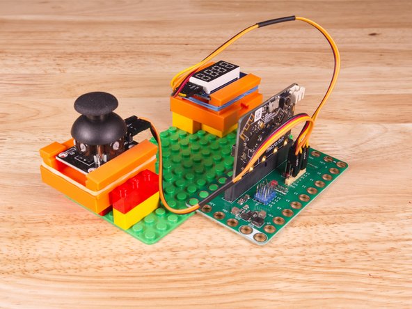 We attached two 2x4 LEGO Bricks to the bottom of the 3D printed holders to allow it to snap onto the LEGO Baseplate a bit easier.