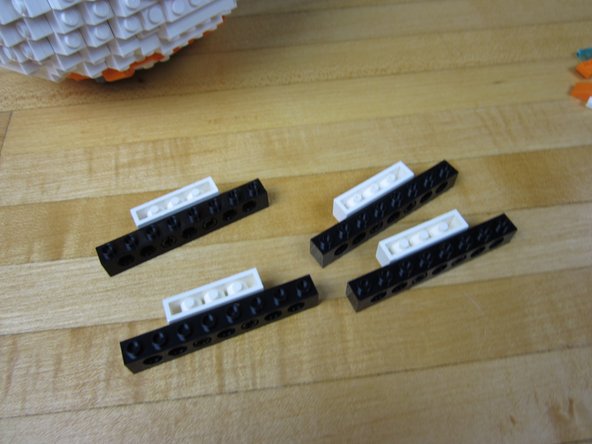 Connect your white bricks UPSIDE DOWN to your black technic bricks.