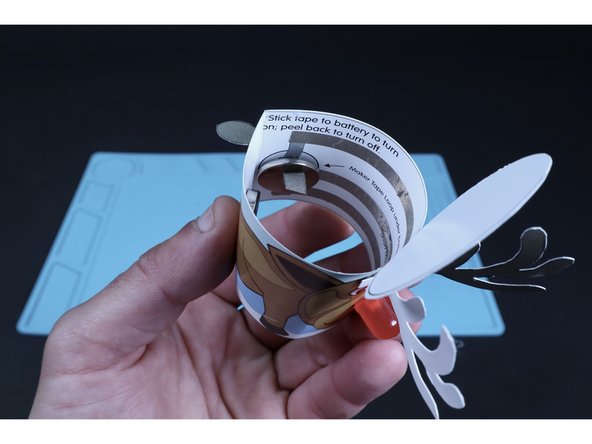 Peel and stick the final piece of Maker Tape to the top of the battery as shown.
