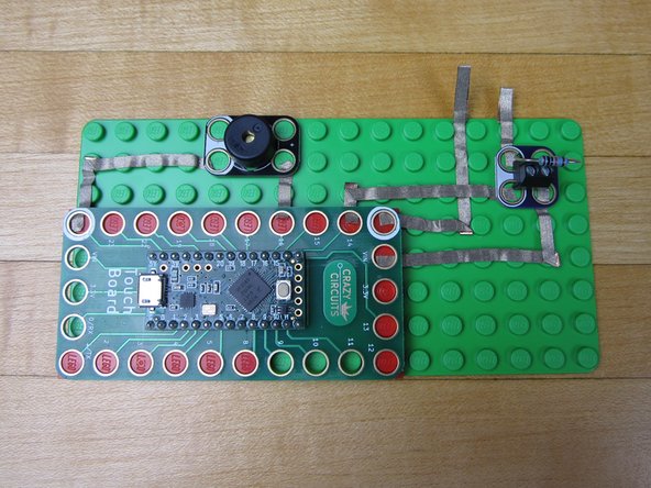 Start by threading a long piece of tape UNDER the pin 14 line of tape.