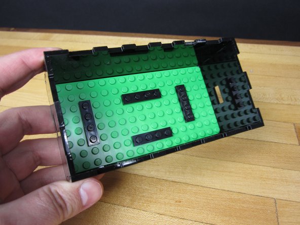 We threw on some 1x4 plates onto our 8x16 LEGO base plate in order to hold the Robotics Board in place before putting things in our box.