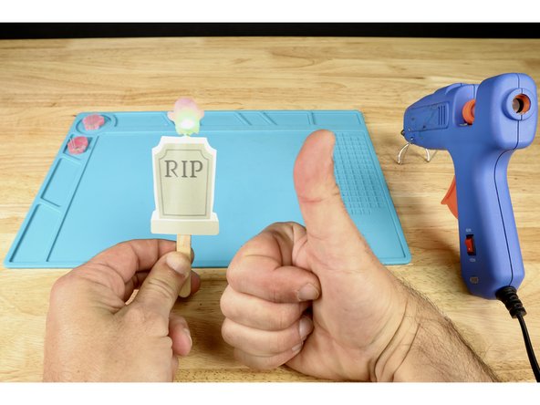 Place the silhouette on top so the circuitry is sandwiched between the two pieces of paper.