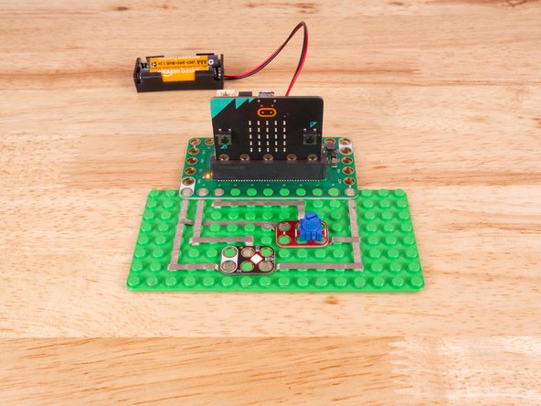 We'll connect our Potentiometer to Pin 1, Ground (GND), and 3.3v BUT! We're going to use the &quot;gutter&quot; between the LEGO baseplate studs so we can have two layers of tape that do not touch.
