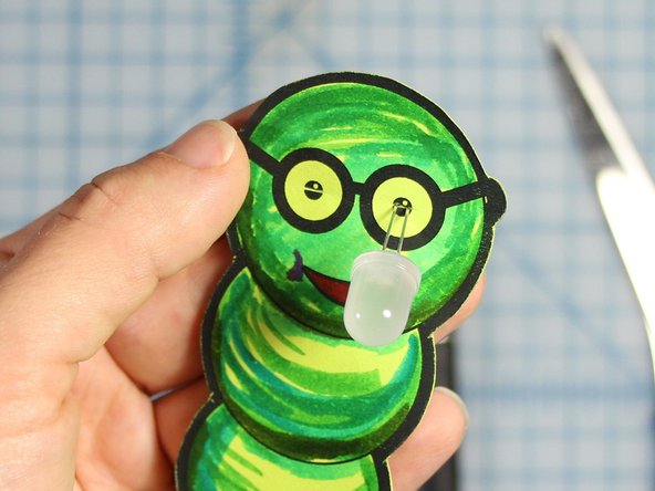 Poke the LED's legs through the slit