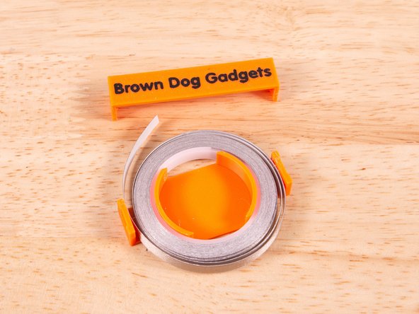 The latest version of our Small Tape Roll Holder (v3) has been simplified. It now consists of the main body and a single clip. There is less chance of the tape getting tangled or twisted now.