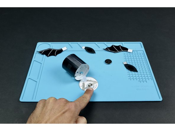 Stick the tape loop onto the end of the tape section that you last placed as shown.