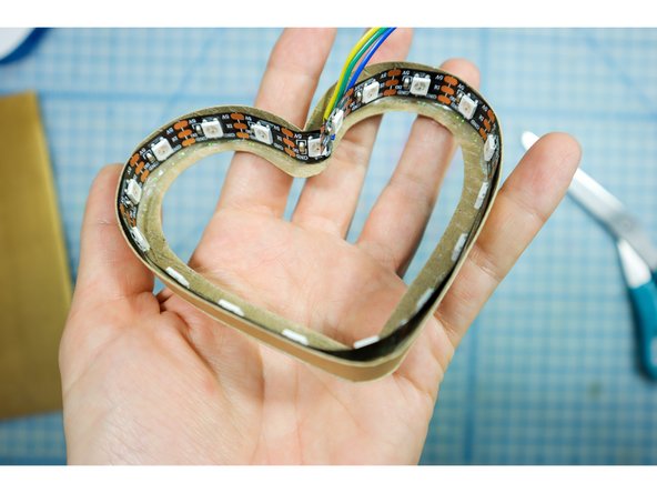 Glue the LED strip into the interior of the heart.