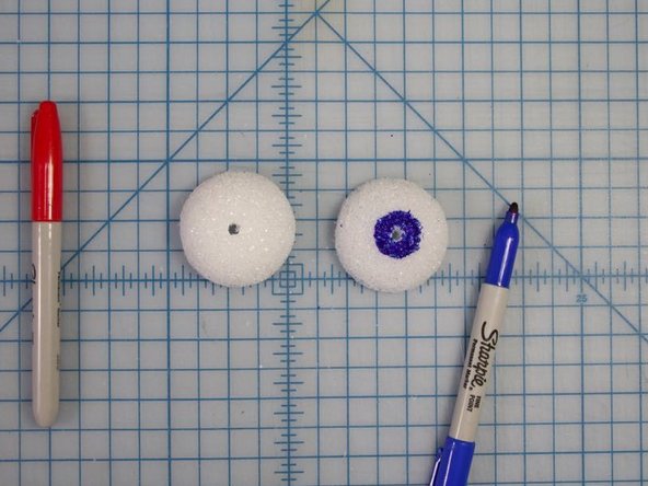 Use markers to decorate your eyes.