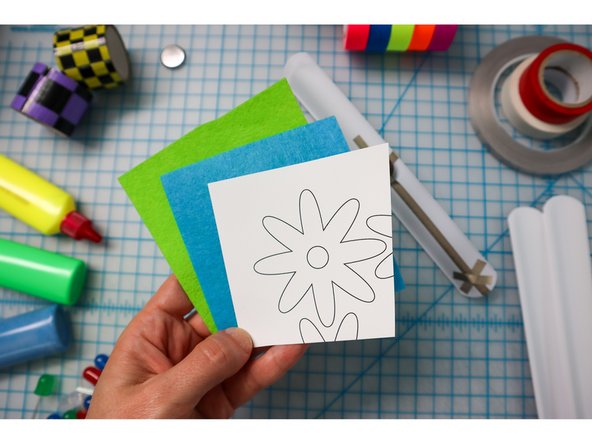 Choose an embellishment from the template and cut it out of foam, felt, paper, or fabric. Glue it over the LED(s).