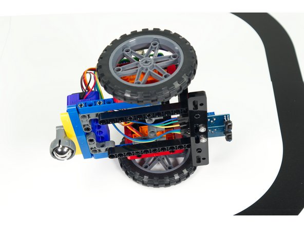 Turn the Rover over again and moved the two black 11 beams back further so the sensors are closer to the body of the Rover.