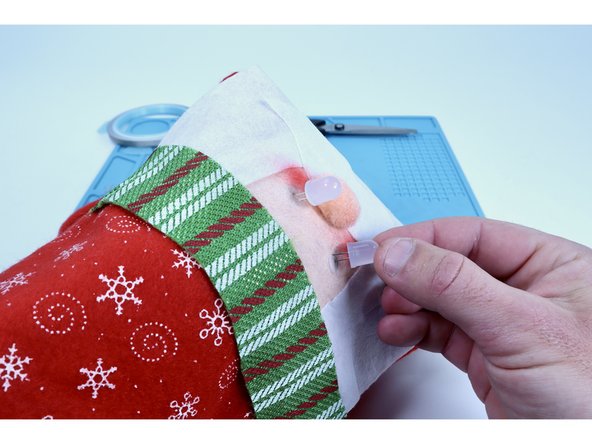 Before threading the LED legs through the holes you just made; know that you will need to orient each of them so that the short legs from each LED are threaded through the inner two holes of the 4 you made in a horizontal row.