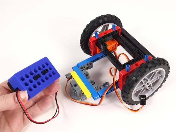 Remove the battery pack from the back of the Rover.