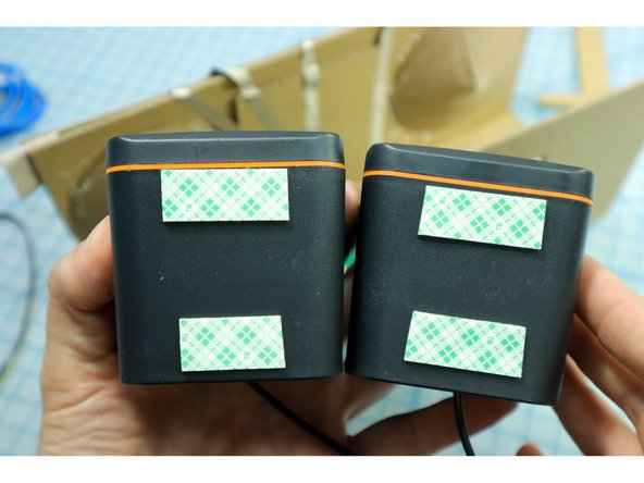 Use foam mounting tape to place the speakers inside the box.