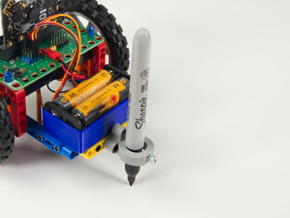 While we used a black permanent marker used you can try colored pencils, crayons, or anything that leaves a mark on paper.