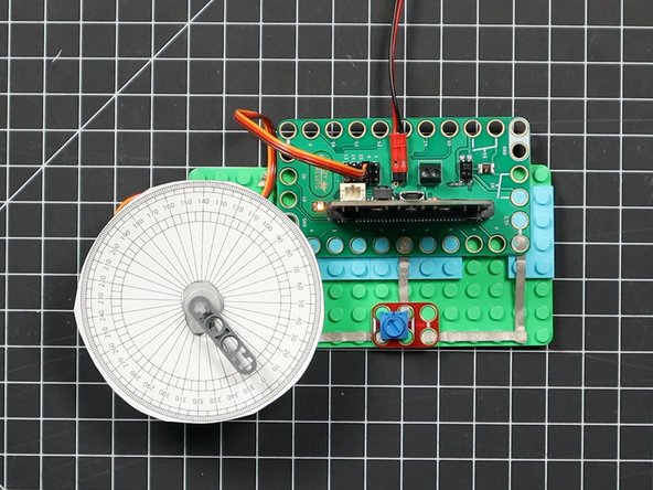 When we set the servo to 0 degrees we can then rotate the guide into place so it lines up the zero with the LEGO beam.
