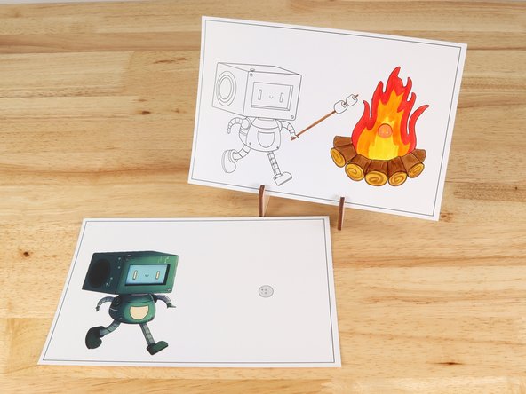 Poke holes through the front of the card for the LED legs, then push the legs through the front.