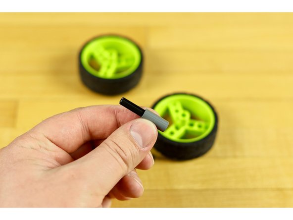 If you wish to use wheels you'll need to use an axle connector and a short axle, as the axle part of the servo isn't long enough to connect to most wheels.