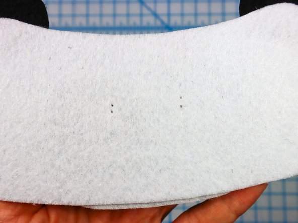 Use a push pin to make two holes for the LED's legs. When the push pin is inside the felt, rotate it around a bit to make the hole larger and easier to see.