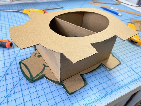 We traced and cut a second pig silhouette out of cardboard, but didn't cut the round hole.